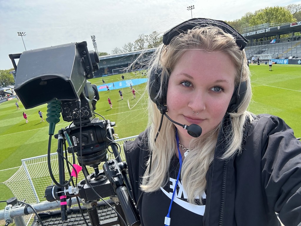 Ellie Lapping camera operating at a football stadium